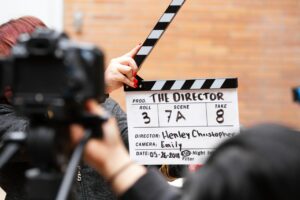 holding a clapper board