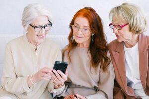 women watching a video on mobile phone