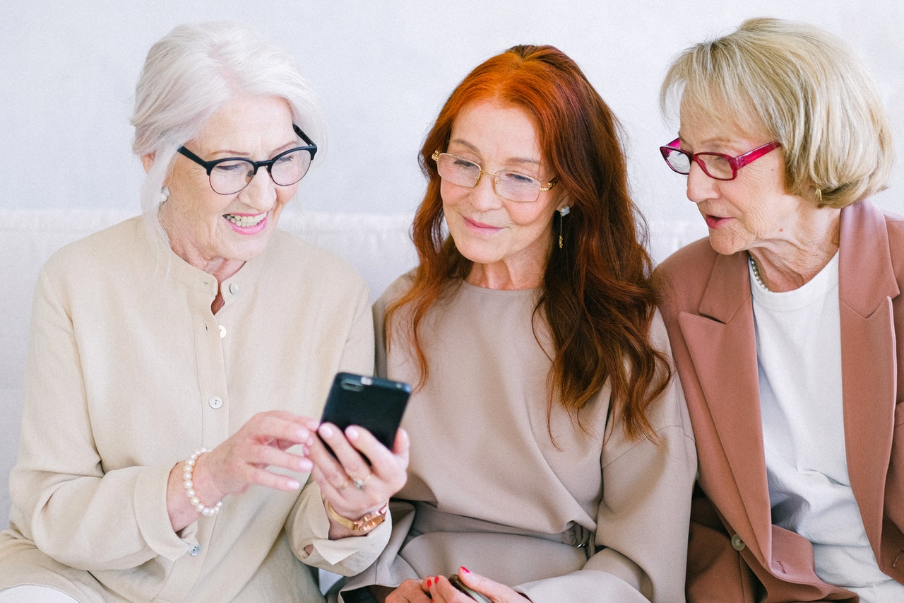 women watching a video on mobile phone