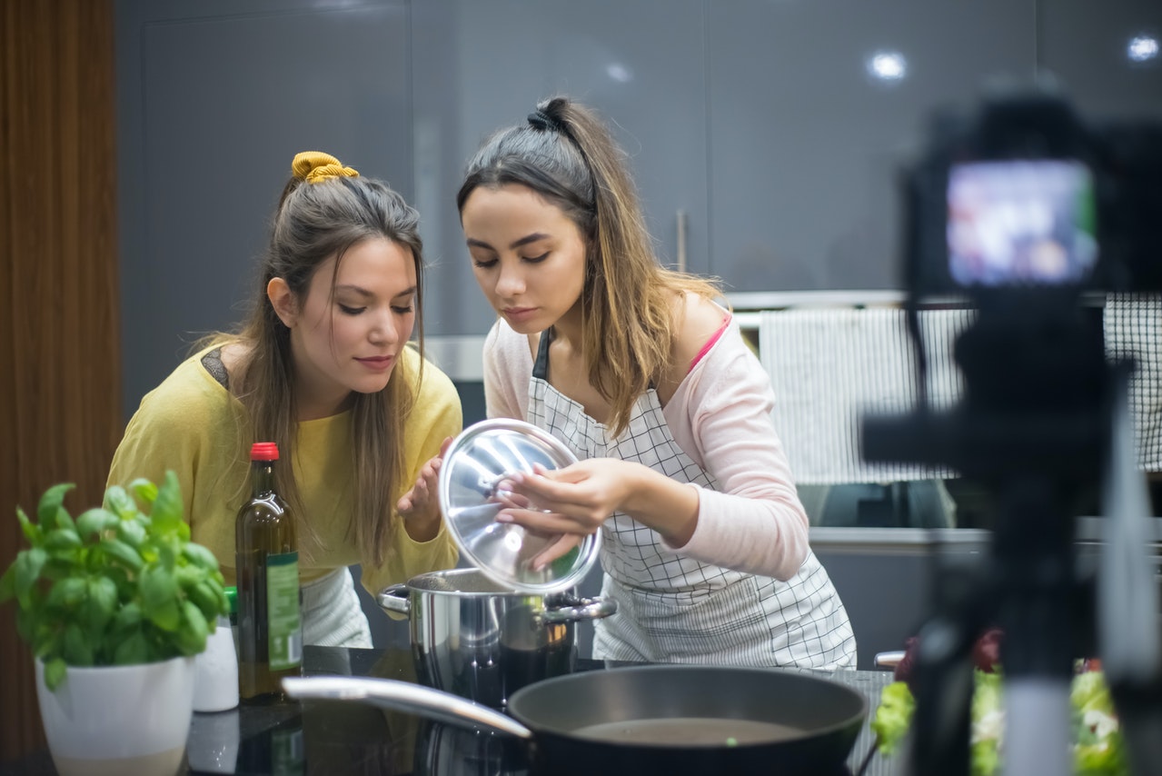 women cooking in front of a camera